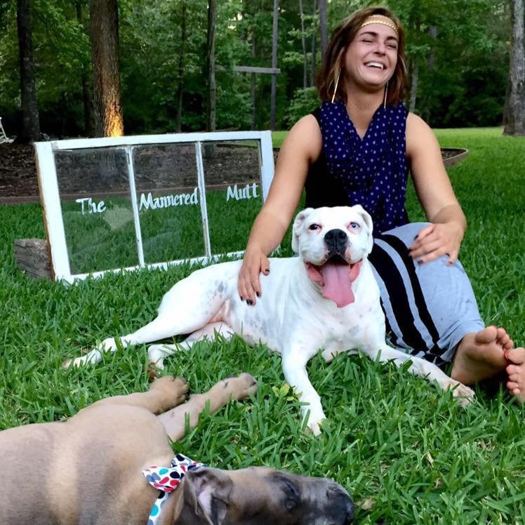Paulina Beck working with a puppy in Puppy Manners training at The Mannered Mutt in Conroe, TX